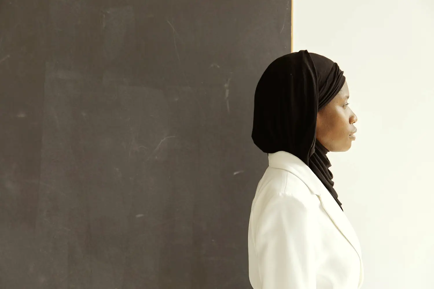 A woman in a hijab facing sideways